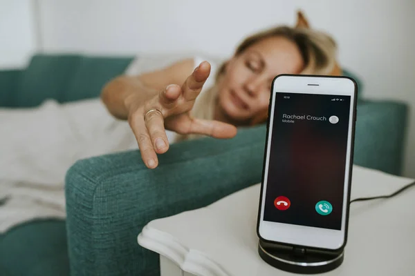 Drowsy Woman Reaching Her Phone — Stock Photo, Image