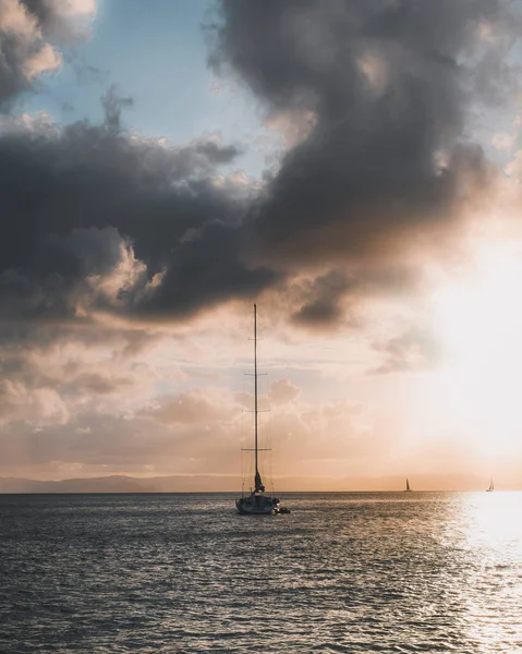 Sailboat under a pastel sky