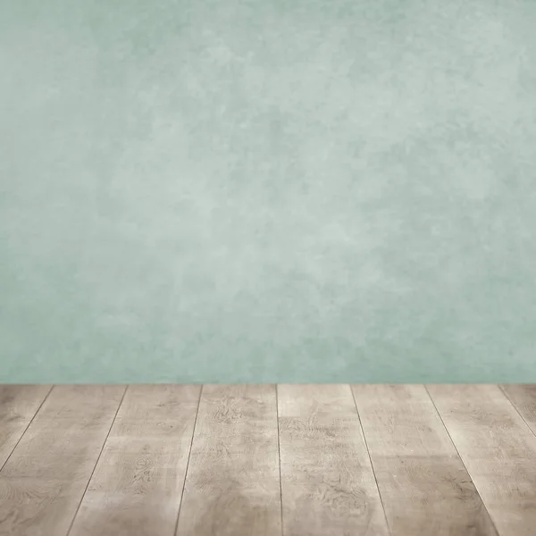 茶色の板床製品の背景を持つパステルグリーン — ストック写真