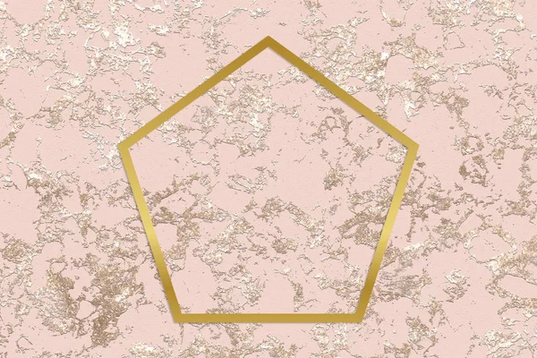 Gold pentagon frame on a rough rose gold background