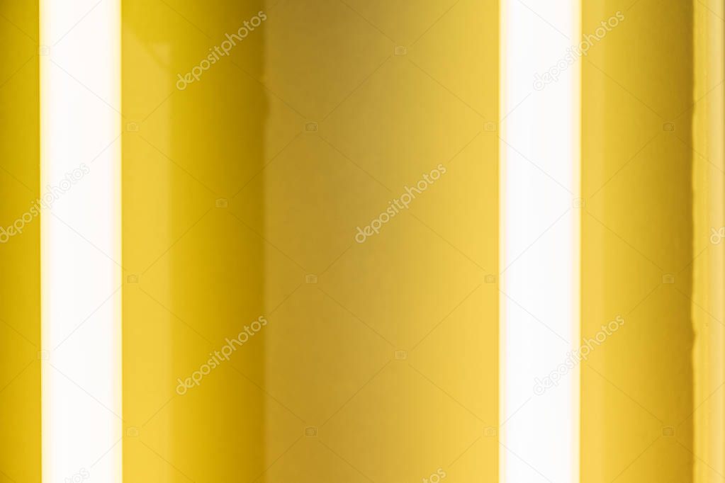Glowing yellow neon tube textured background