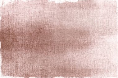 Kumaş dokulu arka planda boyalı pembe altın