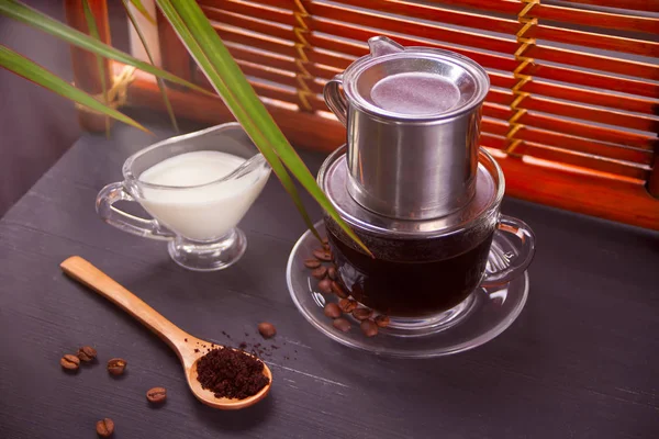Traditional Vietnamese coffee on rustic background in oriental style