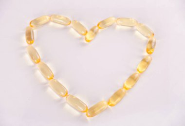 Kapsül şeklinde kalp balık Omega 3 veya Vitamin E. vitamin sağlık promosyon için yağ.