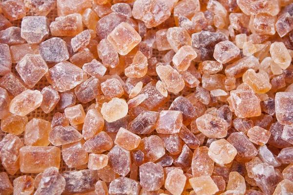 Bruine suiker rock organische kristallijne. Close-up. Bovenaanzicht. — Stockfoto