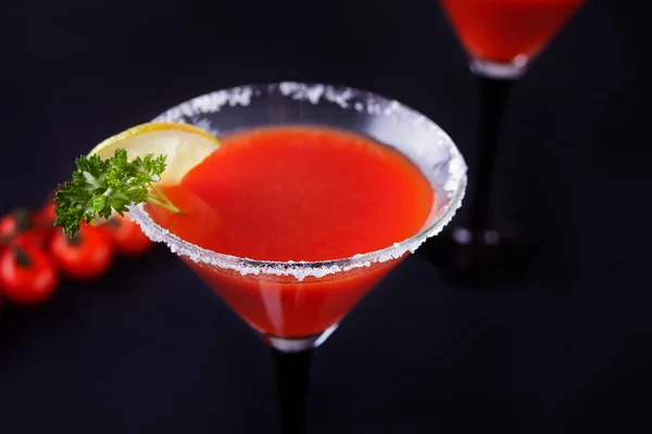 Bloody Mary Cocktail in glasses. Tomato Bloody Mary spicy drink on black background. — Stock Photo, Image