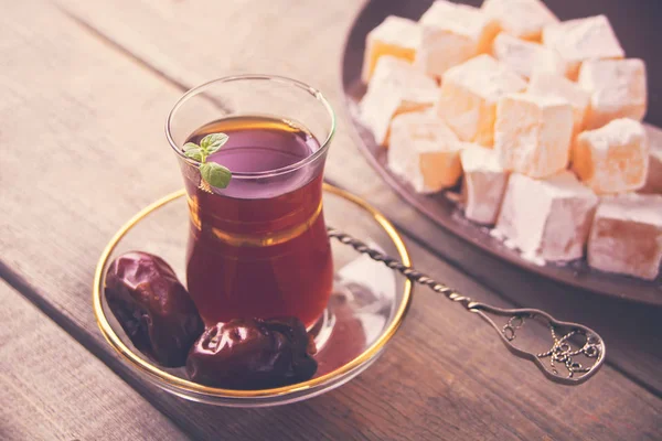 Turkish tea in traditional glass cup on the wooden table — Stock Photo, Image
