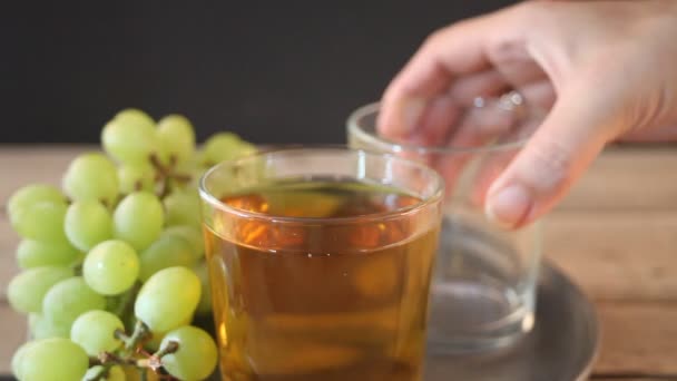 Woman Hand Puts Empty Glass Tray Pouring Drink Green Grapes — Stock Video