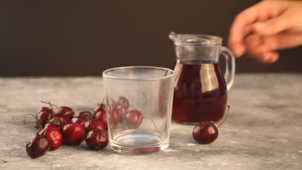 Woman Hand Pouring Jug Glass Fresh Cherry Juice — Stock Video