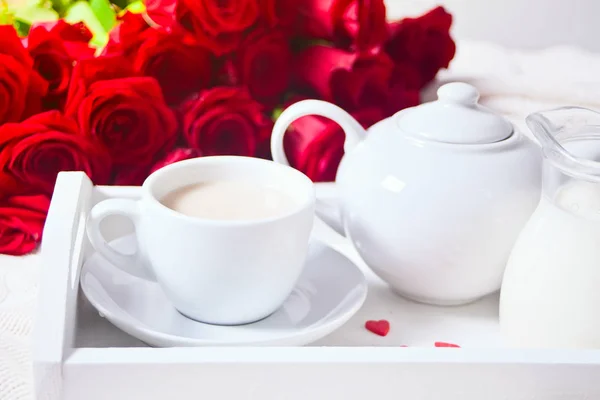 Close up of cup of tea with red rose on the white tray — Stock Photo, Image