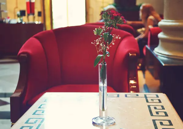 Hotel lobby lounge interior with red armchair and small table — Stock Photo, Image