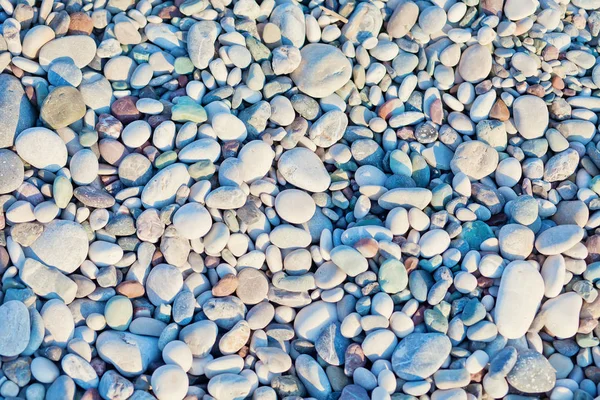 Deniz taşları arka plan. Çakıl taşlı soyut arka plan — Stok fotoğraf