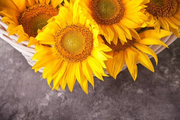 Bouquet of sunflowers in a basket. Copy space