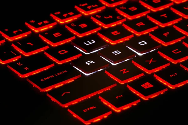 Red Backlit Keyboard Black Background High Resolution Image Gaming Industry Stock Picture