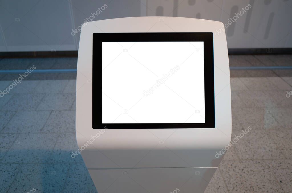 Mockup template/background texture of a blank white touch screen kiosk machine with the background of modern indoor interiors.