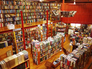 The interiors of a second-hand bookshop with a big selection of books on the shelf. Bendigo, Victoria Australia. Jan 28th, 2016. clipart