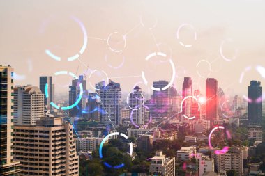 Soyut teknoloji hologramları Bangkok, Asya 'nın panorama şehri görüntüsü üzerinde simgeler. İnsanların ağ kurma ve bağlantı kurma kavramı. Çift pozlama.
