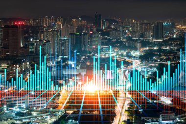 FOREX grafik hologramı, Kuala Lumpur 'un hava gece panoramik şehir manzarası. KL, Asya, Malezya 'da borsa araştırmacıları için geliştirilmiş bir yerdir. Temel analiz kavramı.