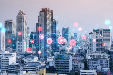 Soyut teknoloji hologramları Bangkok, Asya 'nın panorama şehri görüntüsü üzerinde simgeler. İnsanların ağ kurma ve bağlantı kurma kavramı. Çift pozlama.