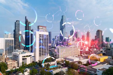Soyut teknoloji hologramları Bangkok, Asya 'nın panorama şehri görüntüsü üzerinde simgeler. İnsanların ağ kurma ve bağlantı kurma kavramı. Çift pozlama.