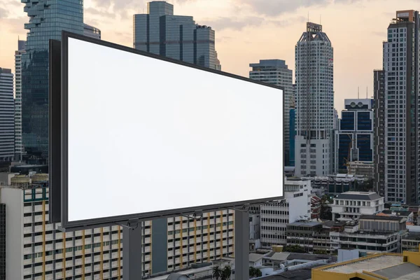 Blank white road billboard with Bangkok cityscape background at sunset. Street advertising poster, mock up, 3D rendering. Side view. The concept of marketing communication to promote or sell idea. — Stock Photo, Image