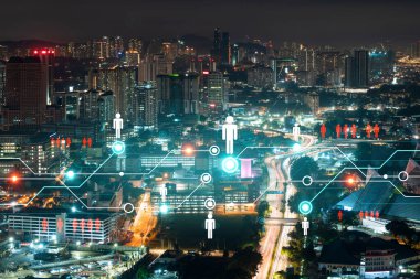 Kuala Lumpur, Malezya, Asya 'nın panoramik şehir görünümünde parlayan sosyal medya simgeleri. KL 'deki insanlar ve şirketler arasındaki ağ kurma ve bağlantı kavramı. Çift pozlama.