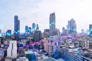 Asya 'daki finans merkezi Bangkok' un Panorama şehri manzarası üzerinde eski ve borsa hologramı. Uluslararası ticaret kavramı. Çift pozlama.