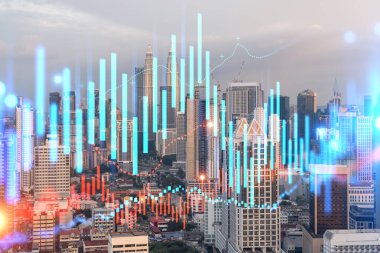 Işık saçan FOREX grafik hologramı, Kuala Lumpur 'un günbatımındaki panoramik şehir manzarası. KL, Malezya, Asya 'da hisse senedi ve tahvil ticareti. Fon yönetimi kavramı. Çift pozlama.