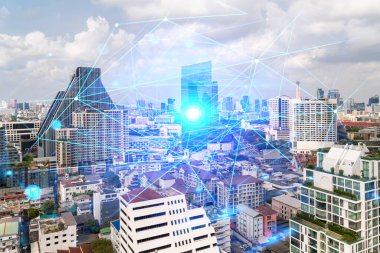 Soyut teknoloji hologramları Bangkok, Asya 'nın panorama şehri görüntüsü üzerinde simgeler. İnsanların ağ kurma ve bağlantı kurma kavramı. Çift pozlama.