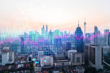 Pazar davranışı hologram gramı, Kuala Lumpur 'un günbatımı panoramik şehir görüntüsü. KL, Malezya, Asya 'da mali derece elde etmek için popüler bir yerdir. Finansal veri analizi kavramı.