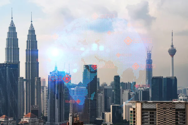 World planet Earth map hologram over panorama city view of Kuala Lumpur, Malaysia, Asia. The concept of international connections and business. Multi Exposure.