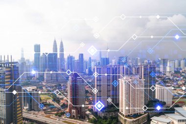 Kuala Lumpur 'un Panorama şehri manzarası üzerinde teknoloji hologramı. KL, Asya 'nın Malezya' daki en büyük teknoloji merkezidir. Kodlama ve yüksek teknoloji geliştirme kavramı. Çift pozlama.