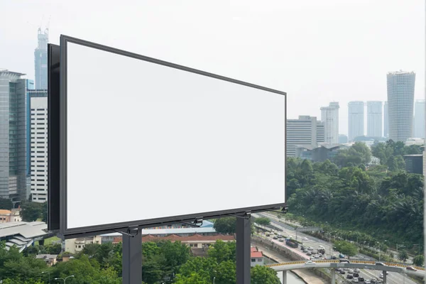 Blank white road billboard with KL cityscape background at day time. Street advertising poster, mock up, 3D rendering. Side view. The concept of marketing communication to promote or sell idea.