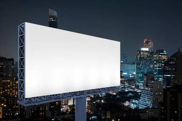 Blank white road billboard with Bangkok cityscape background at night time. Street advertising poster, mock up, 3D rendering. Side view. The concept of marketing communication to sell idea. — Stock Photo, Image