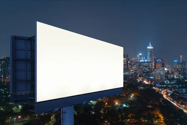 Blank white road billboard with Bangkok cityscape background at night time. Street advertising poster, mock up, 3D rendering. Side view. The concept of marketing communication to sell idea. — Stock Photo, Image