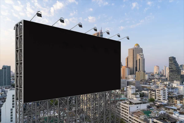 Blank black road billboard with Bangkok cityscape background at sunset. Street advertising poster, mock up, 3D rendering. Side view. The concept of marketing communication to promote or sell idea. — Stock Photo, Image