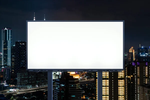 Blank white road billboard with KL cityscape background at night time. Street advertising poster, mock up, 3D rendering. Front view. The concept of marketing communication to promote or sell idea. — Stock Photo, Image