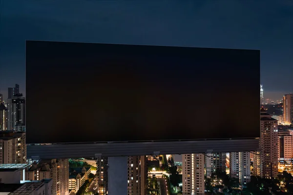 Bianco cartellone stradale nero con Kuala Lumpur sfondo paesaggio urbano durante la notte. Manifesto pubblicitario di strada, finto, rendering 3D. Vista frontale. Concetto di marketing per promuovere o vendere idee o prodotti. — Foto Stock