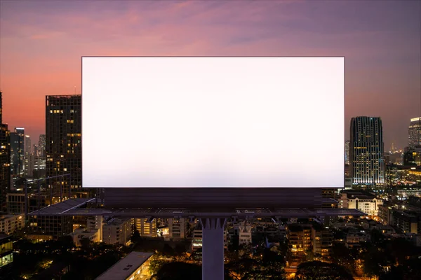 Blank white road billboard with Bangkok cityscape background at night time. Street advertising poster, mock up, 3D rendering. Front view. The concept of marketing communication to promote idea. — Stock Photo, Image