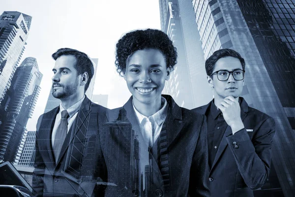 Front view of successful smiling business consultants standing in a row in suits and ready to tackle with customer problem. Singapore cityscape. Multinational corporate team. Double exposure.