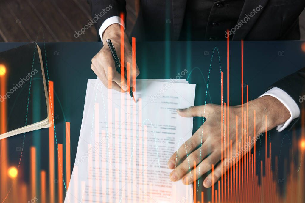 Businessman in suit signs contract. Double exposure with forex graph hologram. Man signing brokerage agreement. Financial market analysis and investment concept.