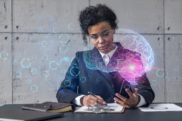 Businesswoman taking notes and brain drawing hologram. Double exposure. Business technology solution.