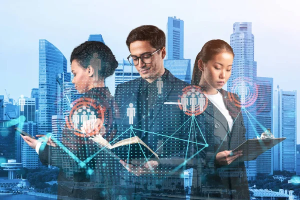 Group of SMM specialists working on social media marketing strategy to achieve business goals. Hologram icons over Singapore background. — Stock Photo, Image