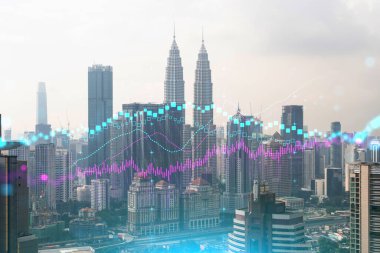 Kuala Lumpur 'un Panorama şehri manzarası üzerinde eski ve borsa hologramı. KL, Malezya, Asya 'daki finans merkezidir. Uluslararası ticaret kavramı. Çift pozlama.