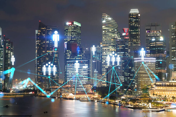 Glowing Social media icons on night panoramic city view of Singapore, Asia. The concept of networking and establishing new connections between people and businesses. Double exposure.