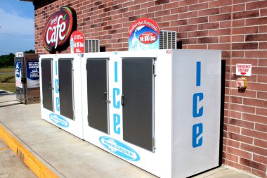 Cartersville, GA May 27, 2020 Ice Machine holds bags of frozen ice for purchase by retail consumers. clipart
