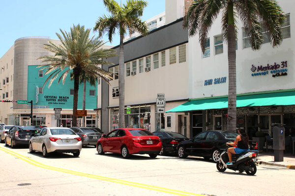 South Beach,Miami May 09, 2019: Busy intersection along South Beach's Collins Ave. signals the beginning of spring tourist season.