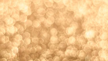 Altın Festivali, Noel 'in bokeh arka planını bozdu. Soyut parlak arkaplan, Bokeh 'in odağından çıkarılmış altın ışıklarla parıldadı. Kopyalama alanı olan parlak gradyan arkaplan. Altın düğün, yeni yıl konsepti.