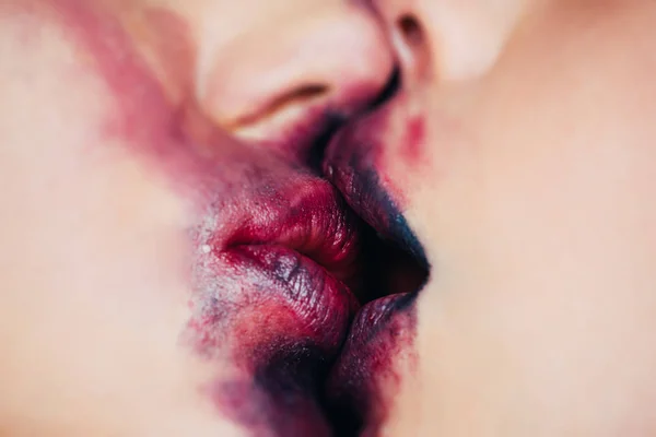 Closeup of women mouths kissing. Sensual lips kisses of two beautiful sexy lesbian women. Lesbian Couple Together Concept. Passion and sensual touch
