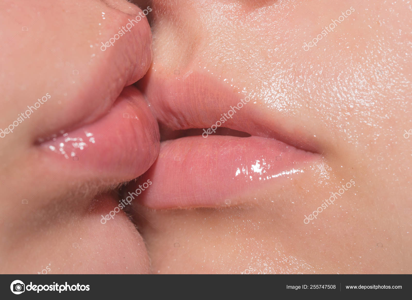 Lesbian kiss. Woman mouth together. Sensual kiss. A homosexual couple. Love and sex. Same-sex marriage. Female lips close-up. Sexy seductive kiss. Two women close up picture